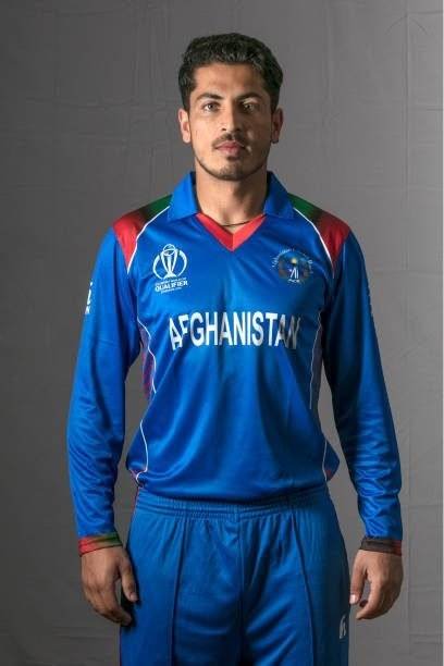 HARARE, ZIMBABWE - FEBRUARY 26: Sharafuddin Ashraf of Afghanistan poses for a picture during the Afghanistan Portrait Session for the ICC Cricket World Cup Qualifier at Meikles Hotel on February 26, 2018 in Harare, Zimbabwe. (Photo by Julian Herbert-ICC/ICC via Getty Images)